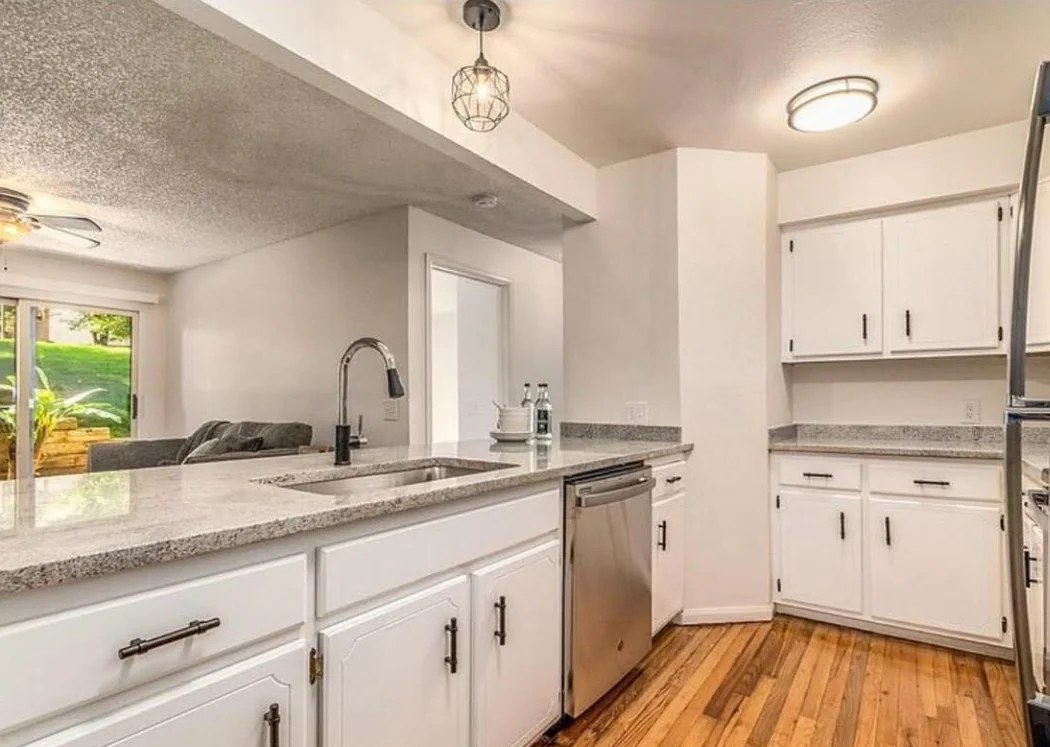 Spotless kitchen with granite counters after move-out cleaning in a Denver home