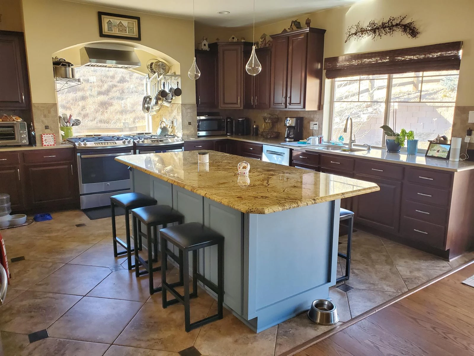Bright, spotless kitchen with granite island after a professional CleanVista house cleaning in Denver